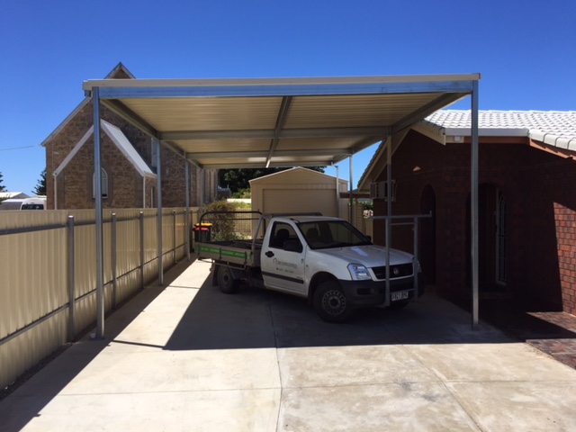 A photograph of a company car parked under cover