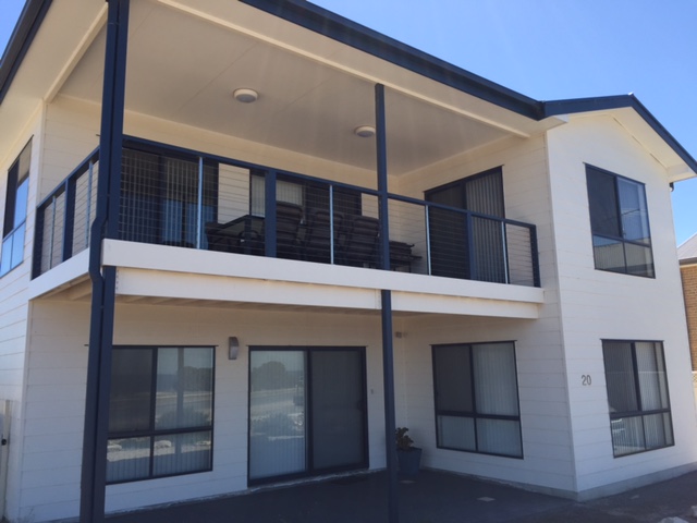 A photograph of a two storey timber frame home